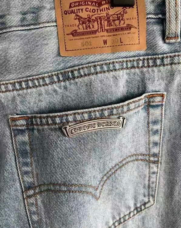 CHROME HEARTS Blue Jeans With Black Leather Crosses